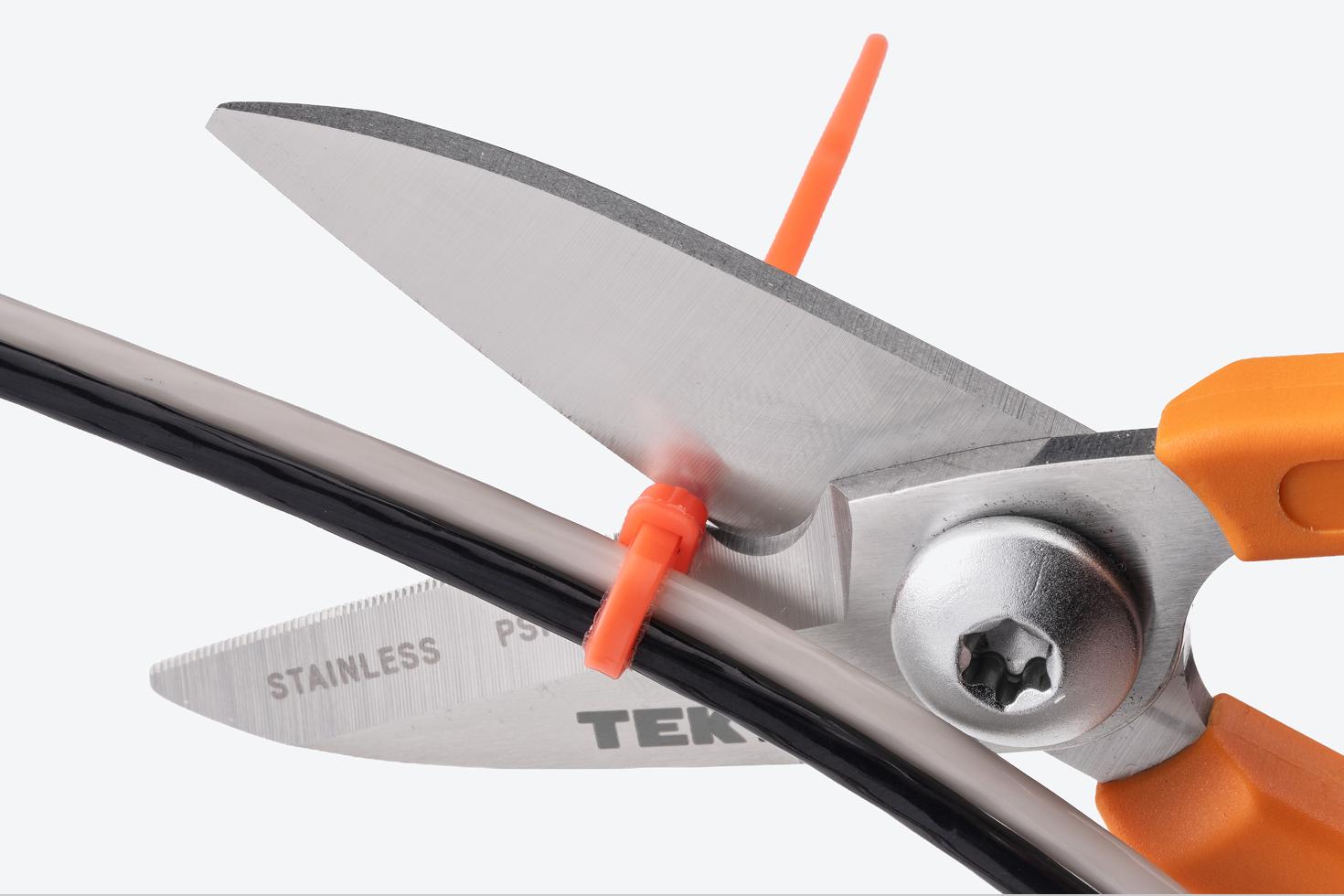 Scissors cutting a zip tie