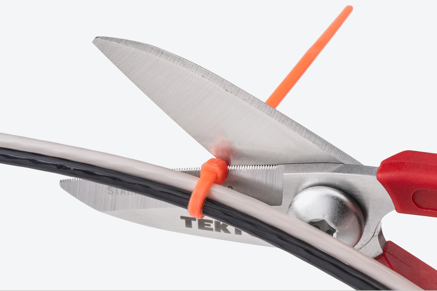 Scissors cutting a zip tie