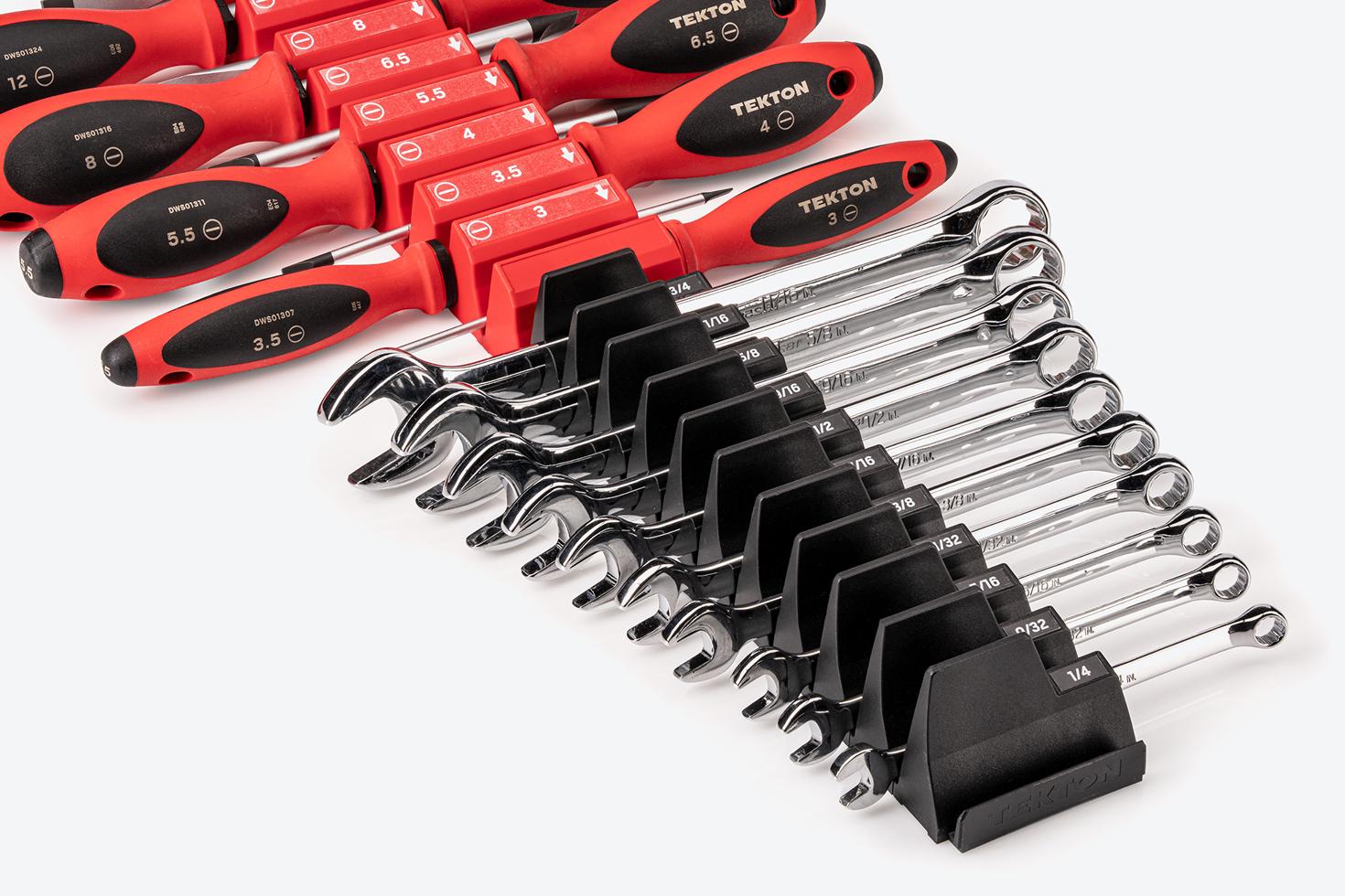 A set of Tekton combination wrenches in black modular wrench organizers and a set of Tekton drivers in red modular driver organizers. All of the organizers are connected.