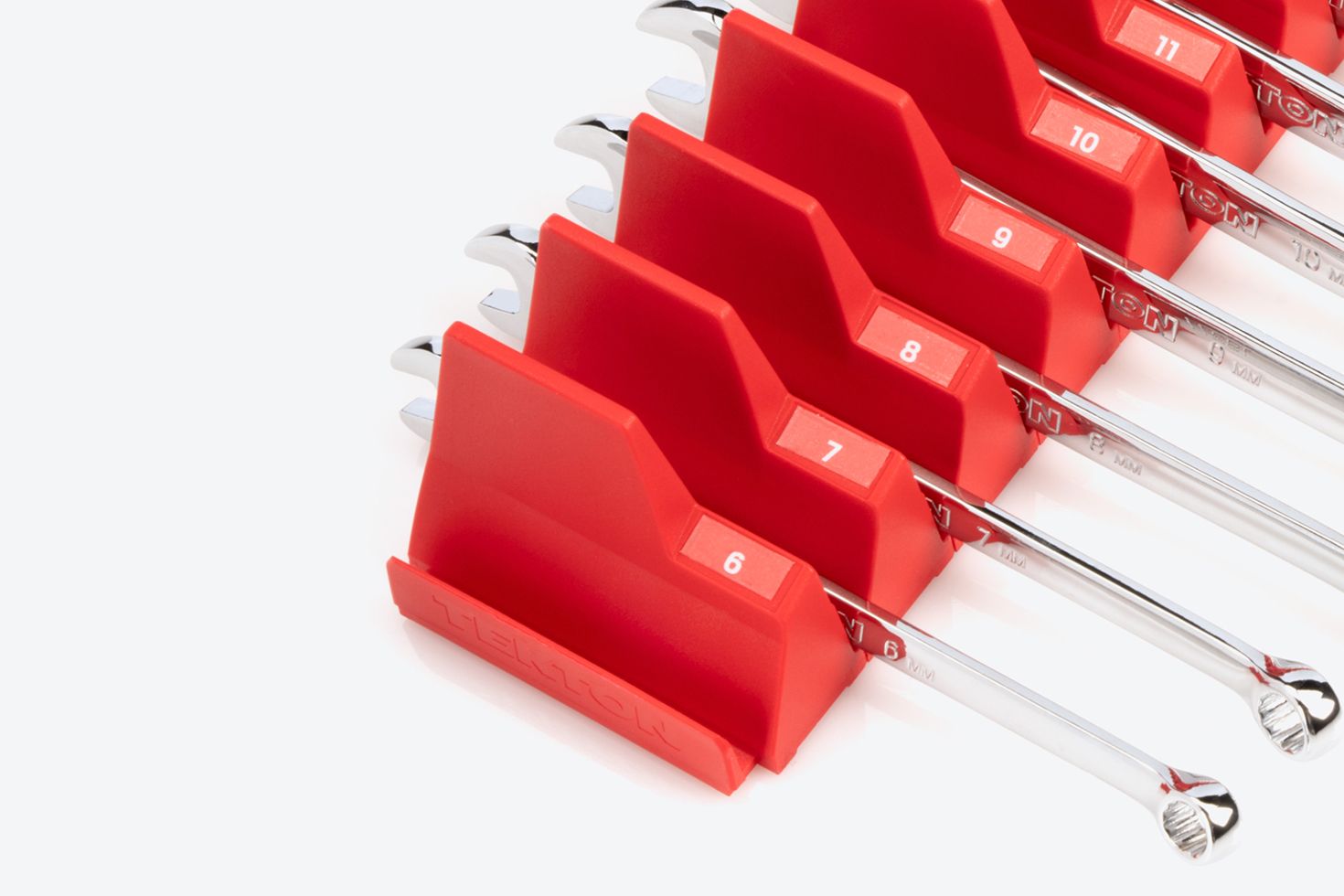 Red modular wrench organizers with labels for metric wrenches.