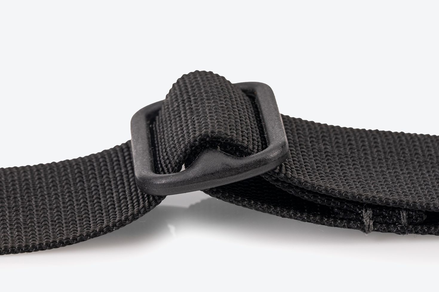 Close-up view of the metal adjustment slider on a strap