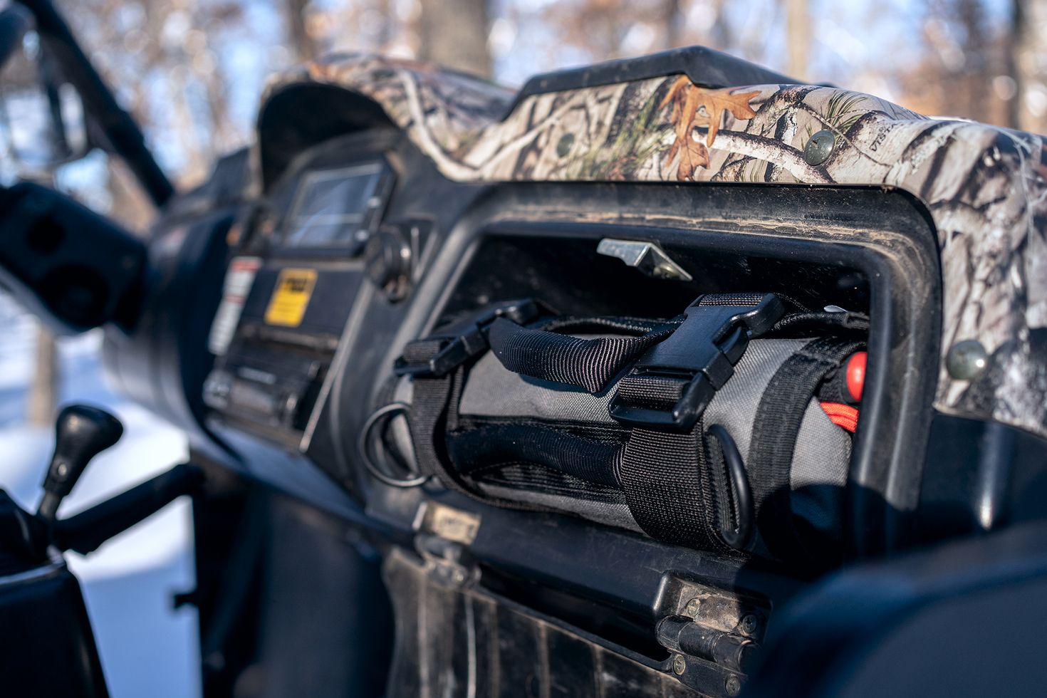 A gray MTR2 Mini in the glovebox of an ORV