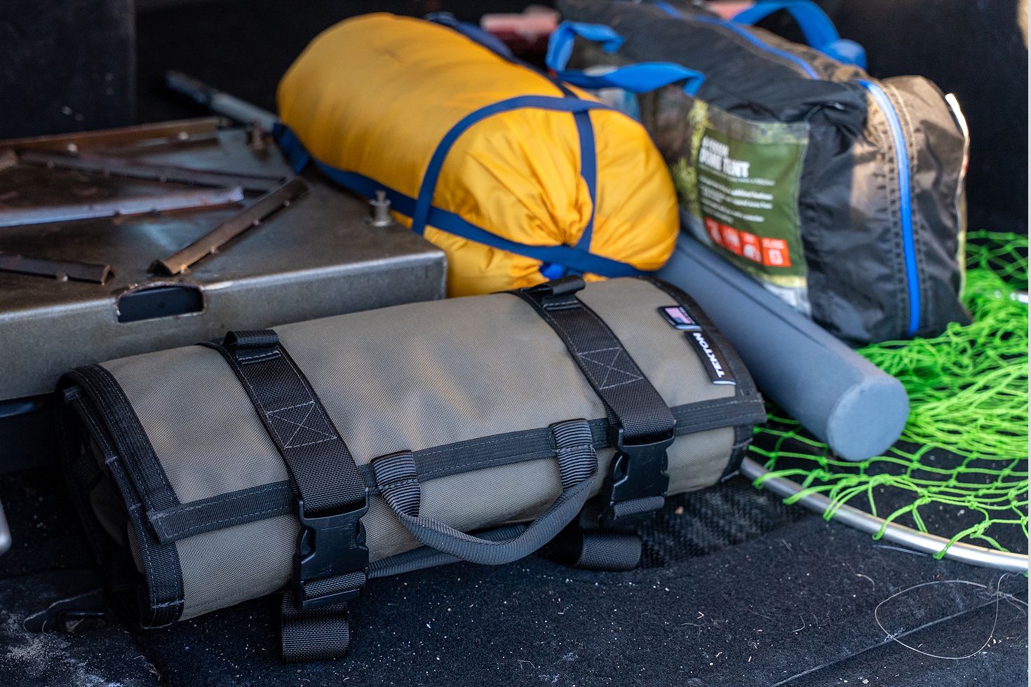 An MTR3 in a vehicle surrounded by camping equipment