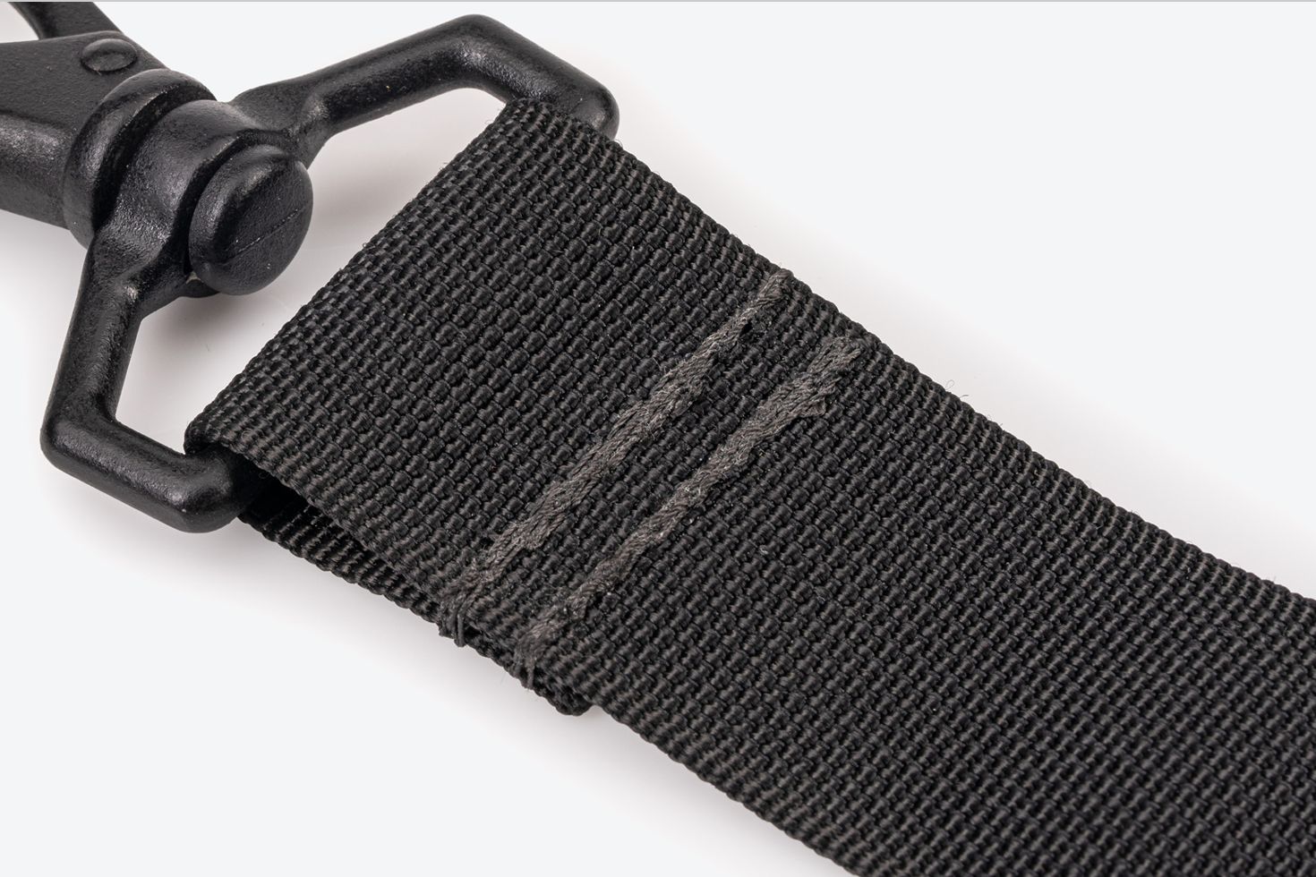 Close-up view of the stitching near the hook on a strap