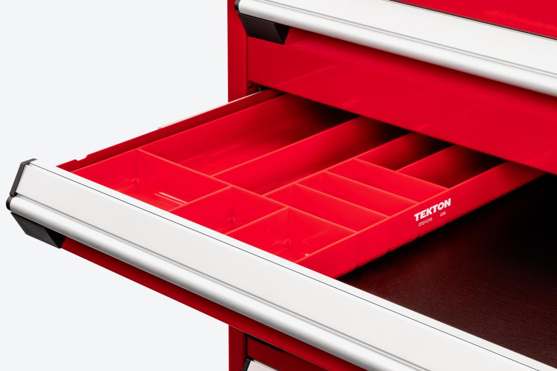 A red tool cabinet with a red 10-compartment organizer tray in an open drawer