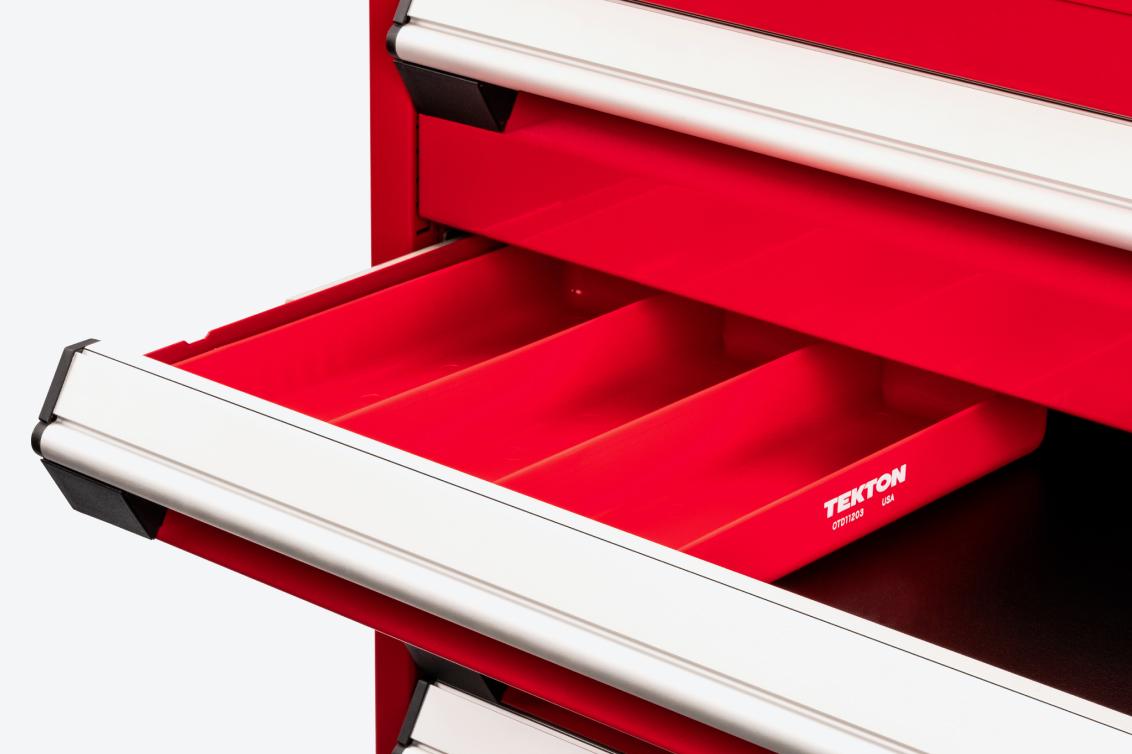 A red tool cabinet with a red 3-compartment organizer tray in an open drawer