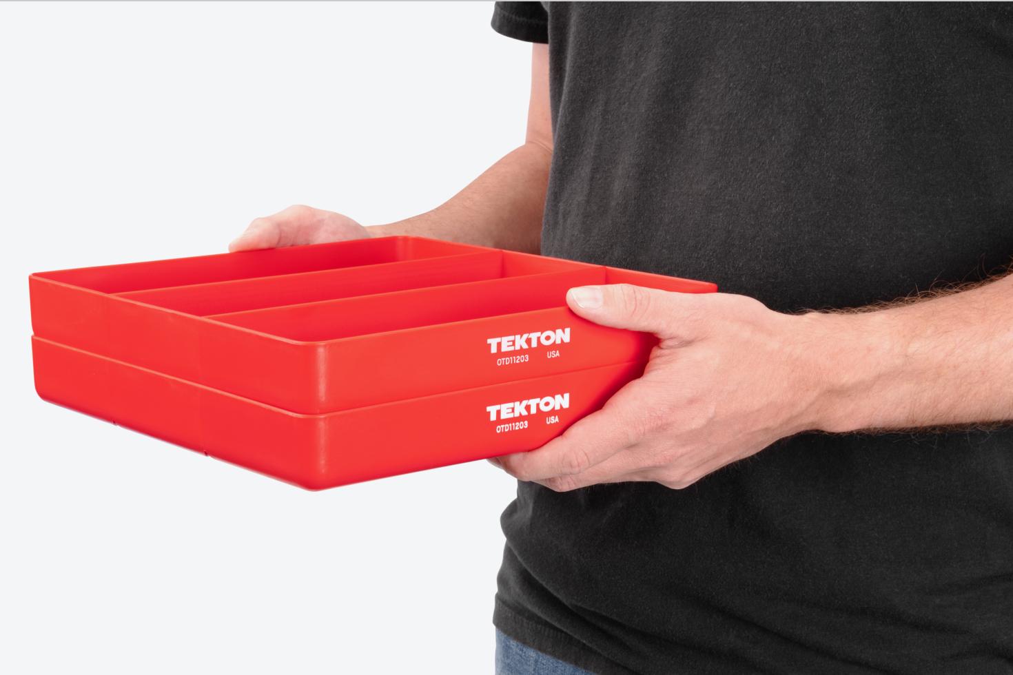 A person holding two red 3-compartment organizer trays