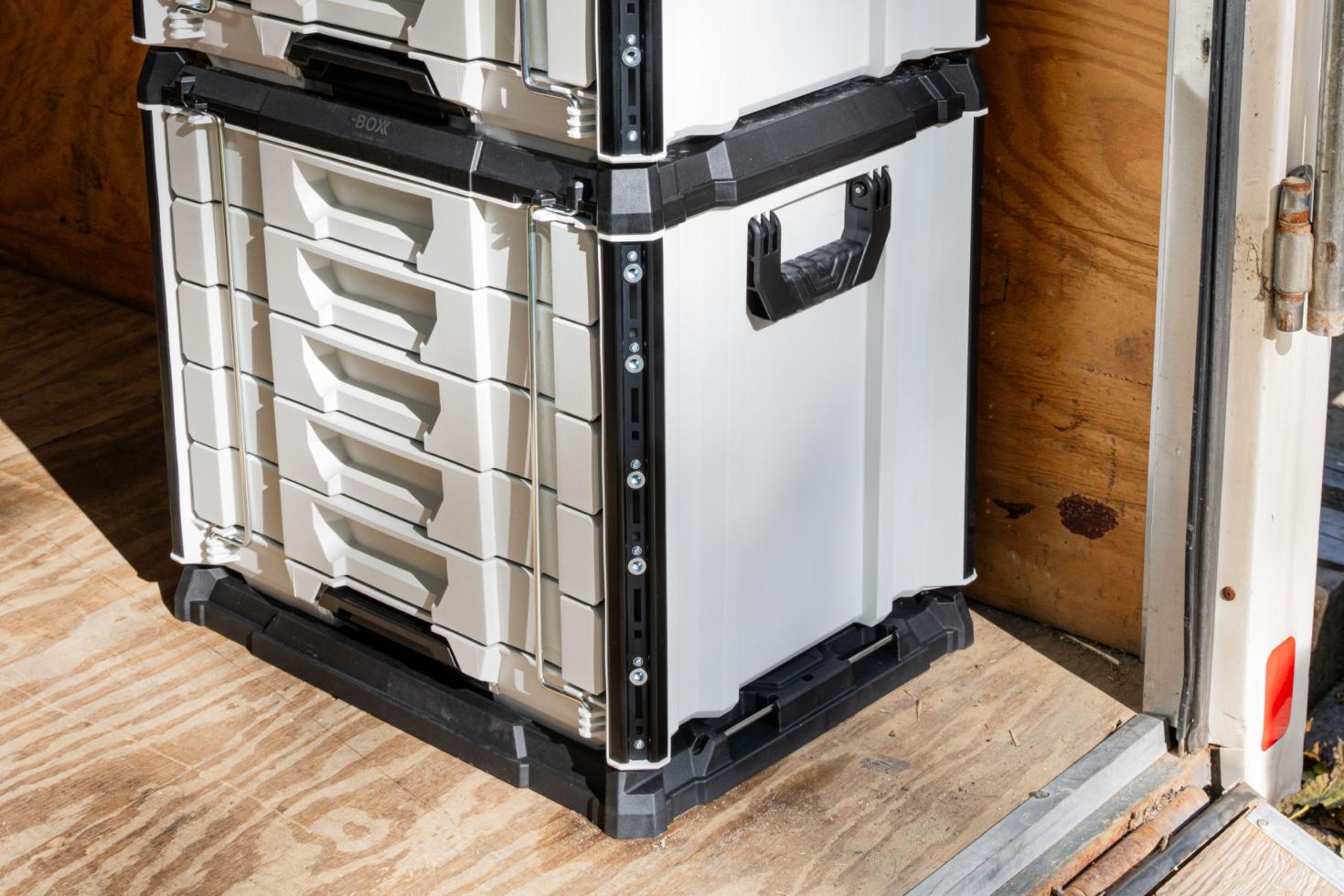 A RIG tool box mounted to the floo of an enclosed trailer