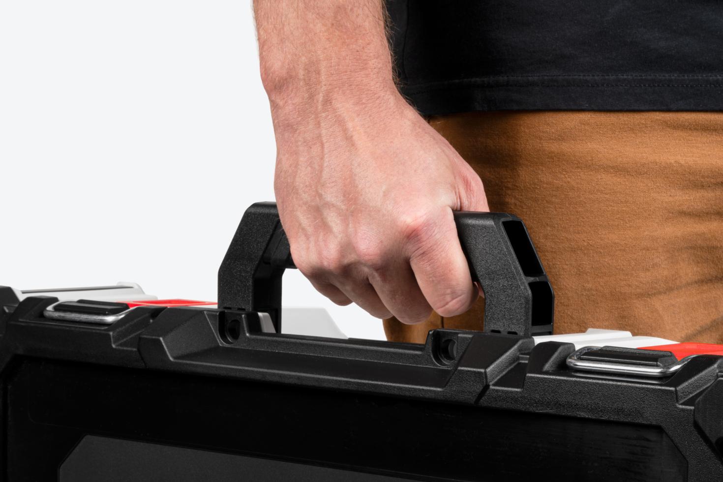 A tool box being held by the handle