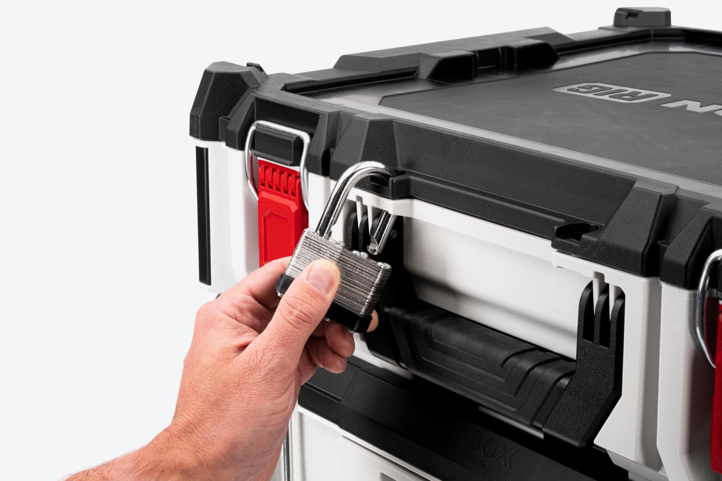 A padlock being removed from a tool box