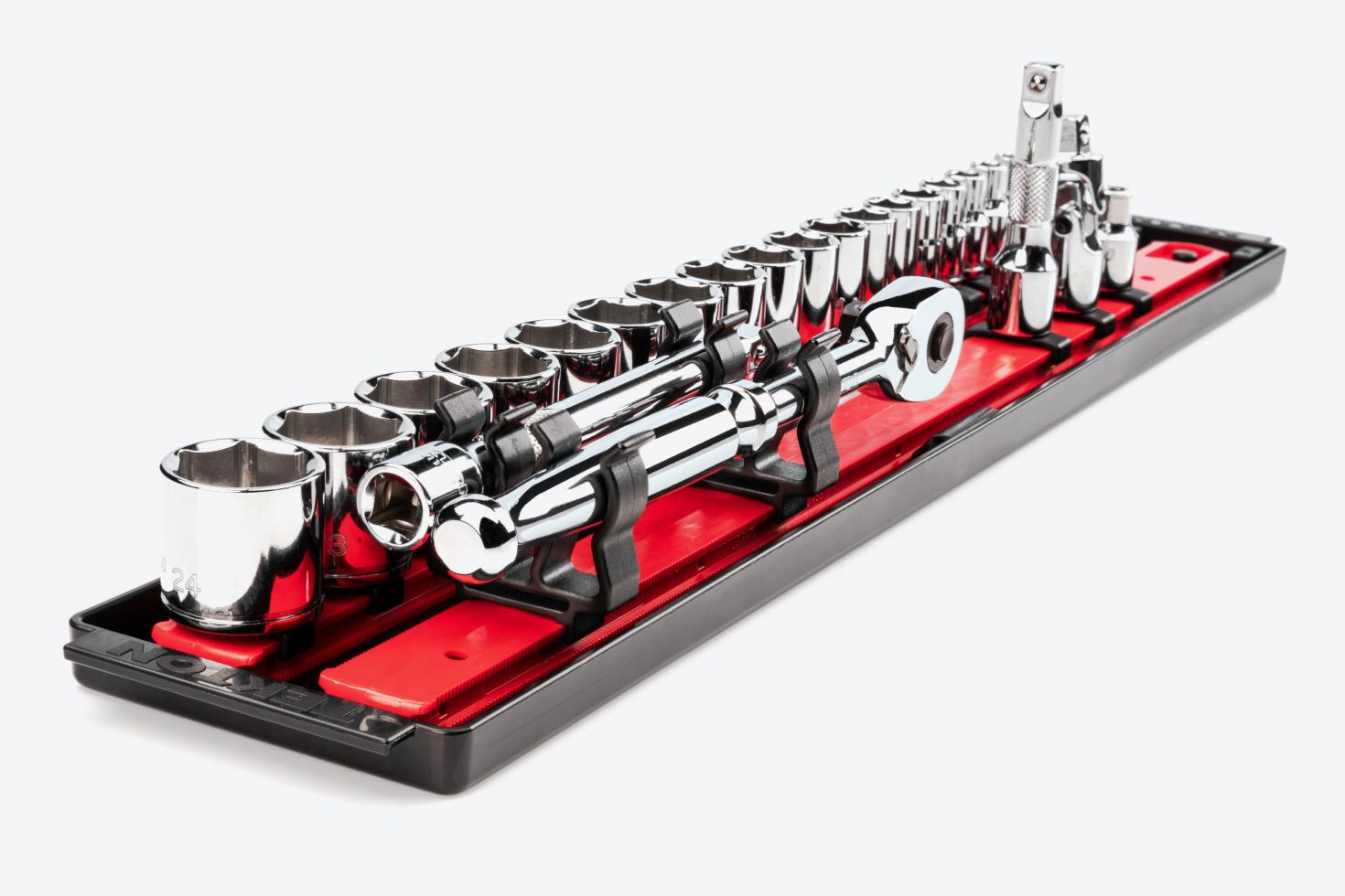 A tray with red socket rails with sockets and top-mount holders holding a ratchet and extension.