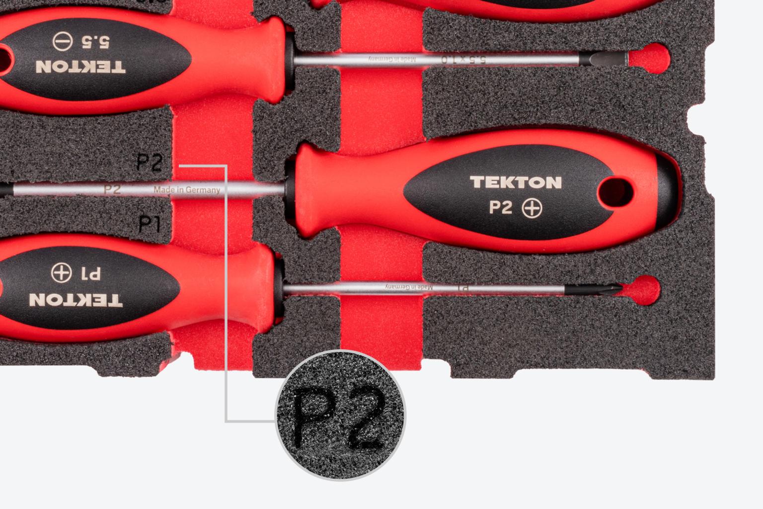 Close-up view of a P2 marking on a piece of foam with Tekton screwdrivers.