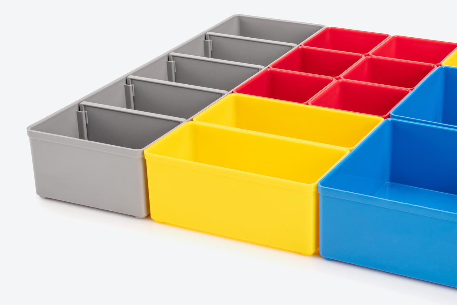 All colors of shallow organizer bins shown: red, yellow, blue, and gray.