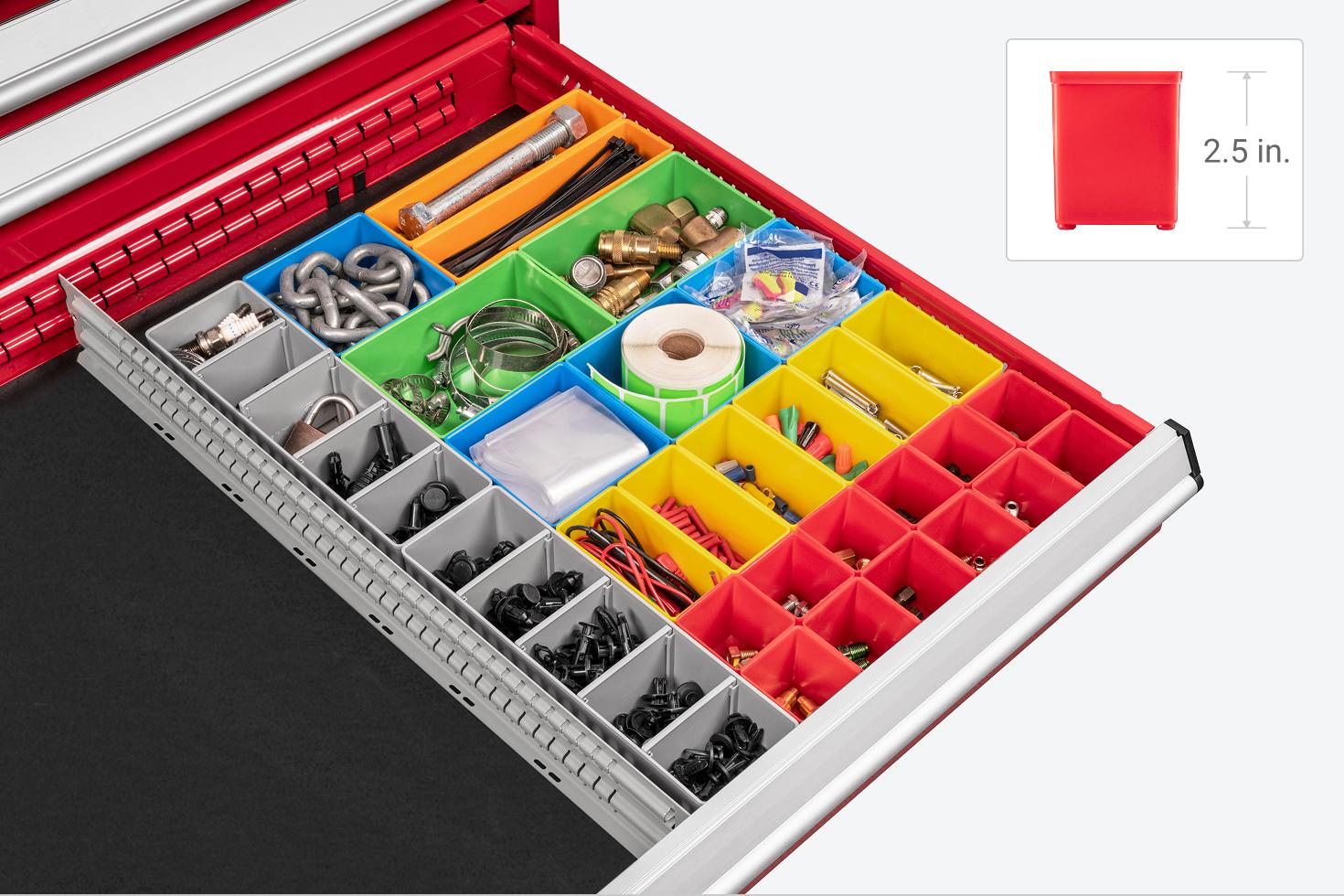 A variety of organizer bins in a red Tekton tool cabinet drawer.