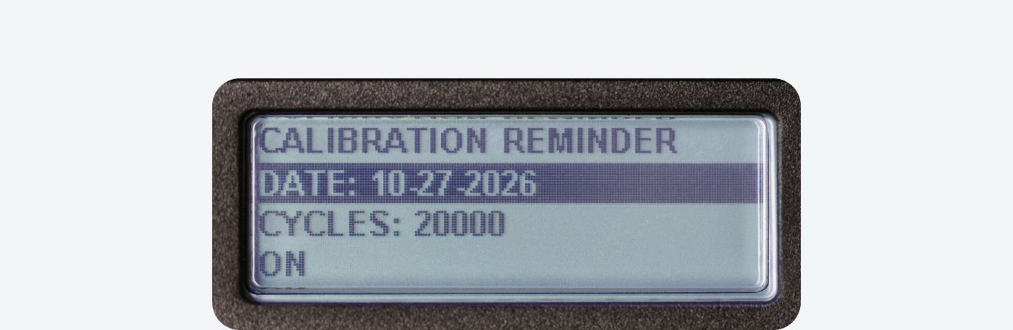 An electronic torque wrench screen showing the calibration reminder menu