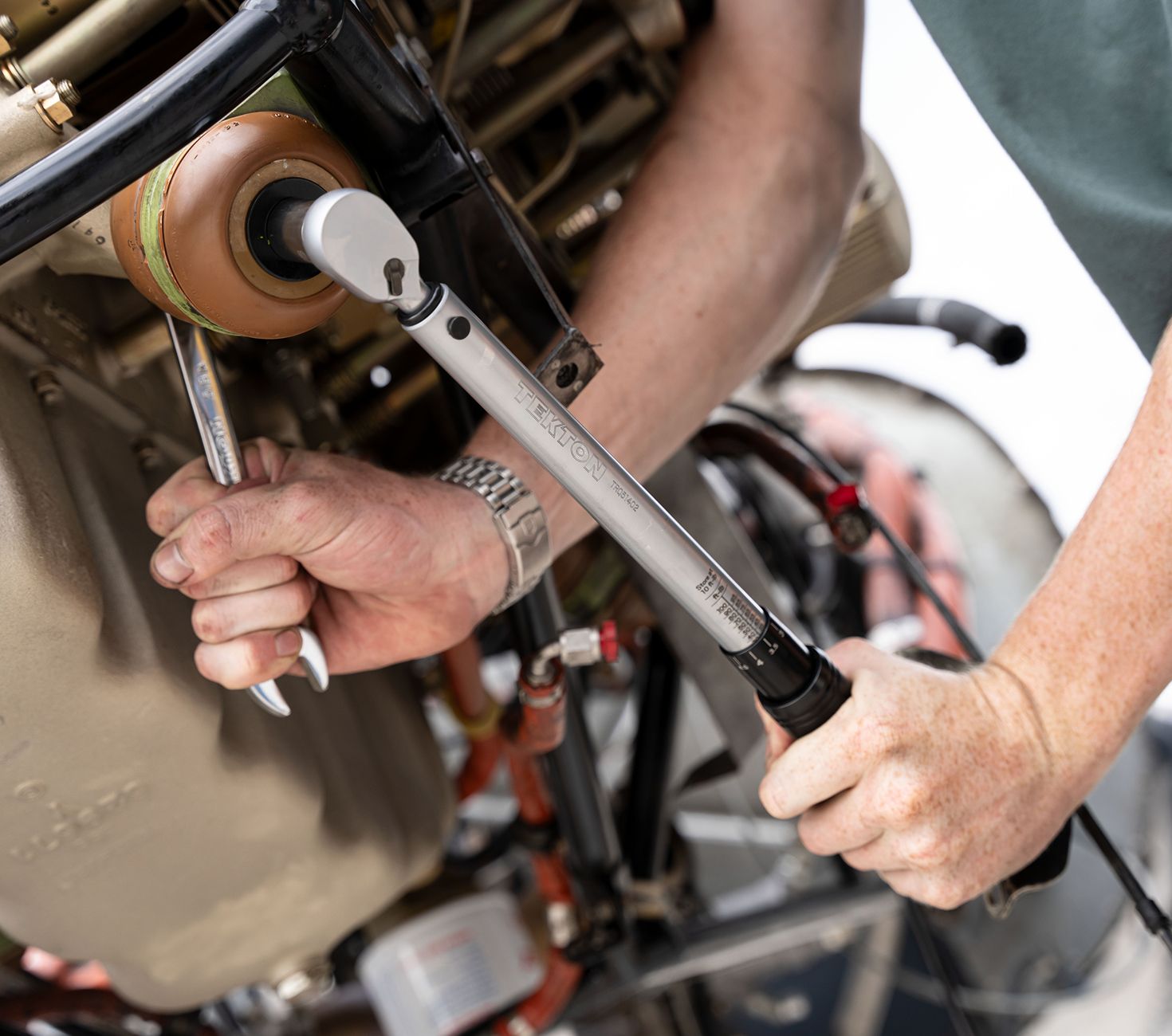 A micrometer torque wrench being used.