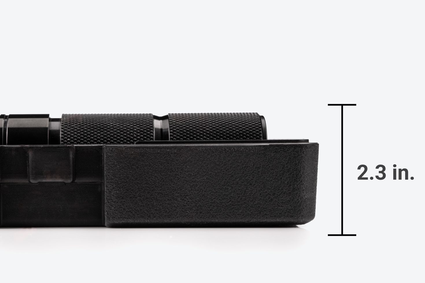 With the lid off, the case and wrench are 2.3 inches tall.