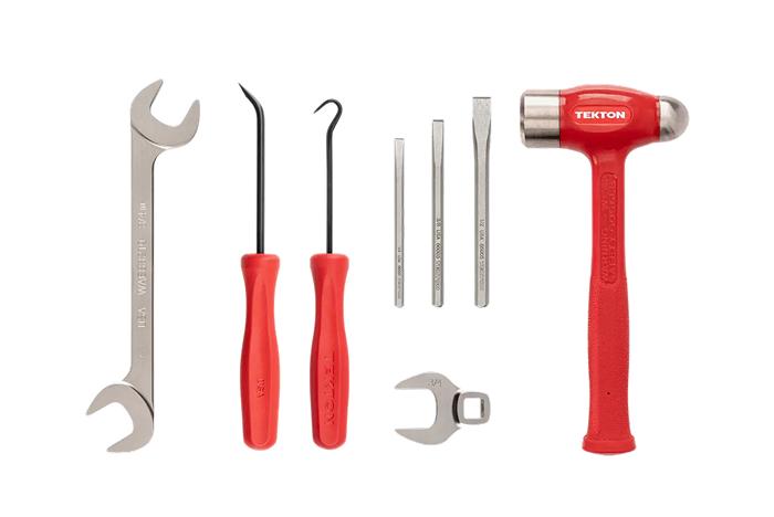 A Tekton angle wrench, mini pry bar, hook, chisels, crowfoot wrench, and ball peen dead blow hammer.