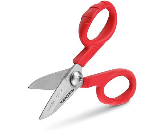 A person holding Tekton's red-handled shop scissors