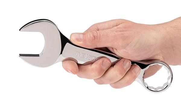 A person holding #18060 Tekton 1-1/4 stubby combination wrench