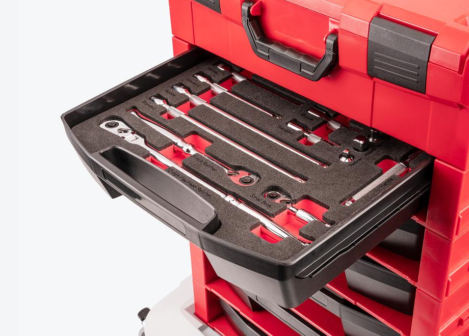 A Tekton stacking organization stack with pulled out open top drawer, foam, and hand tools