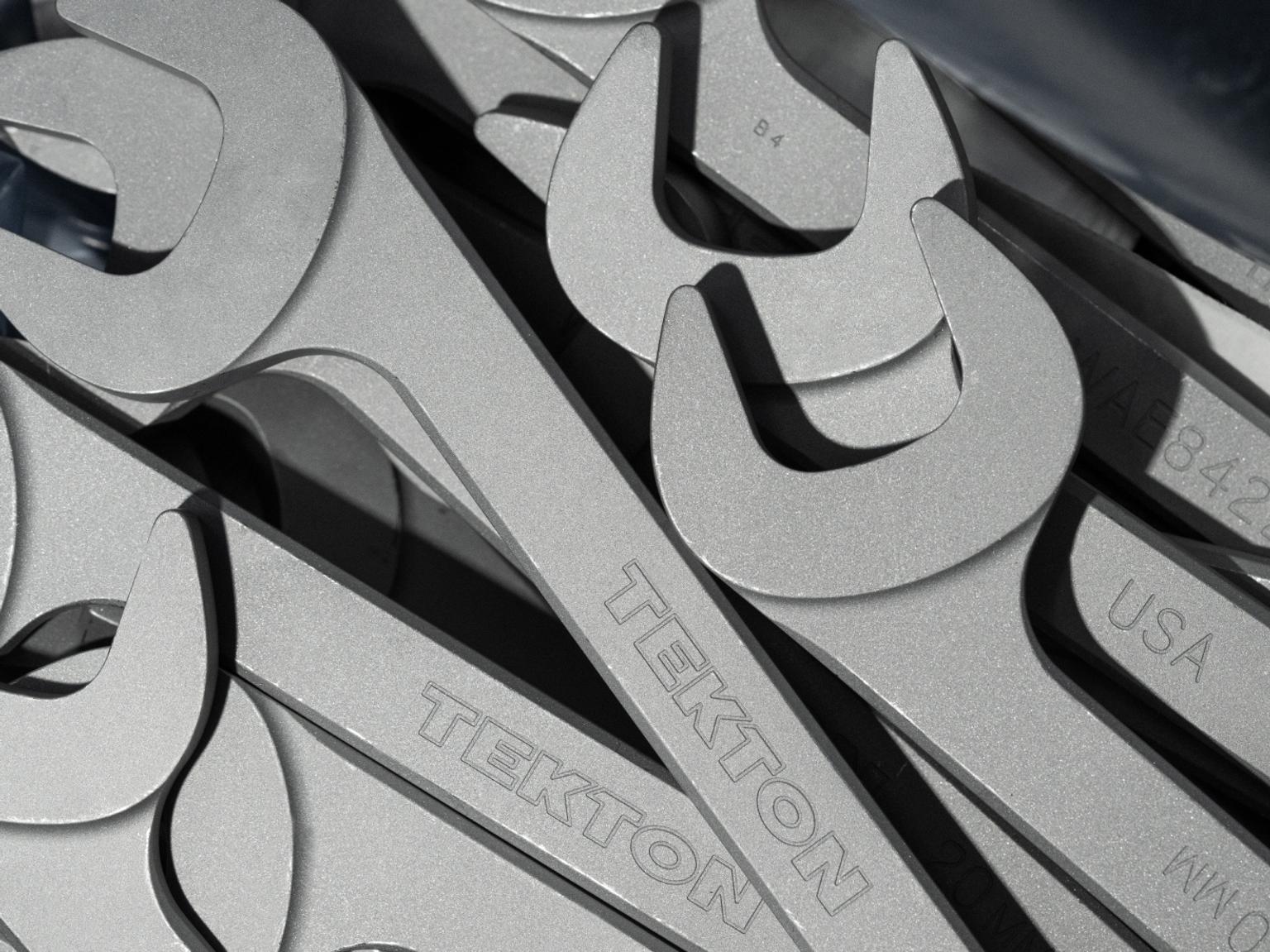 A pile of Tekton wrenches being manufactured.